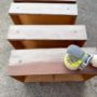 sanding drawers with ryobi to prepare furniture for paiint