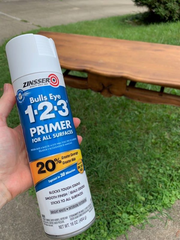 a wood console table about to receive a coat of primer to cover where old furniture hardware holes have been filled and sanded for a smooth painted finish. This is a step in how to replace hardware furniture process