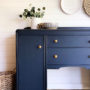 learn how to replace furniture hardware like changing handles out for knobs like this blue buffet