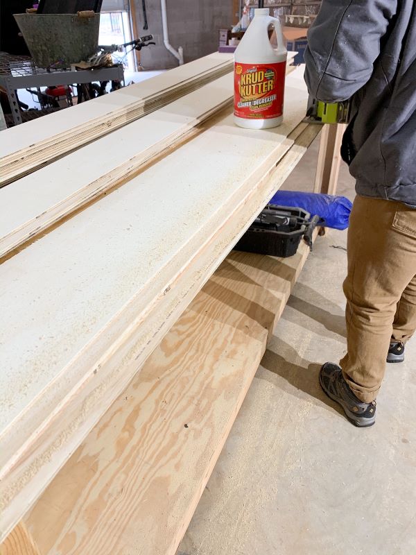 When your guide board is set, use a circular saw to cut down your plywood to the desired plank size for your shipap wall.