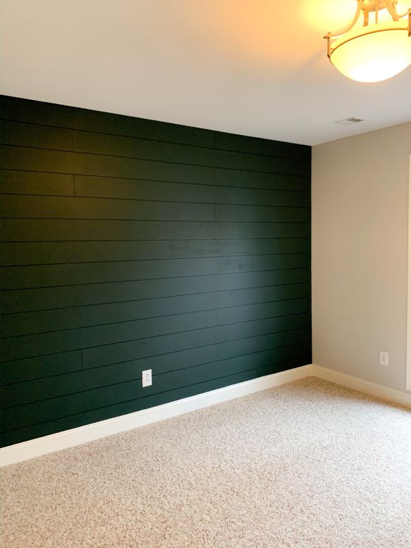 How to plank a wall - finished! Our dark green accent wall resembles tongue and groove shiplap at a fraction of the price!