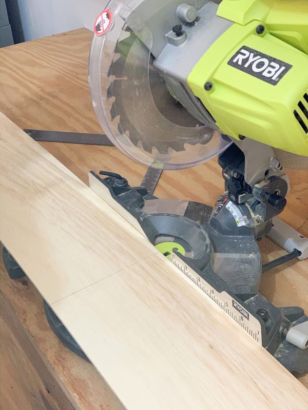 Using a ryobi circular saw, we cut down our plywood planks from 8ft to 4ft for our shiplap wall.