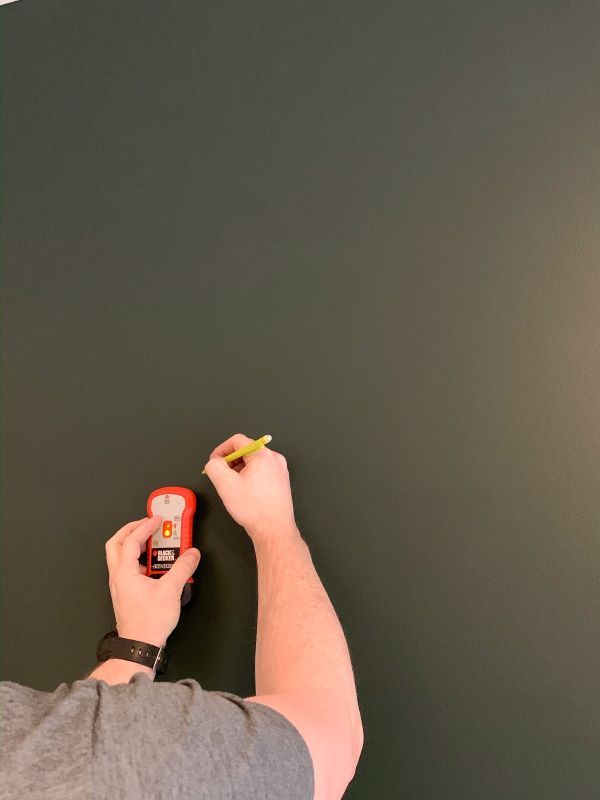 Use a stud finder to locate the studs on your wall and mark them so you know where to nail your planks for your DIY shiplap