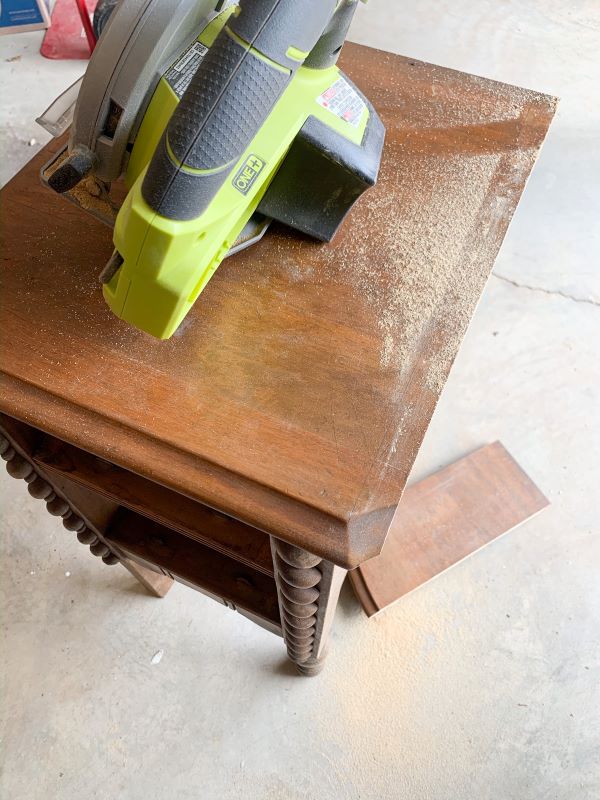 Deconstruct a wood vanity into end tables by cutting down the top with a circular saw