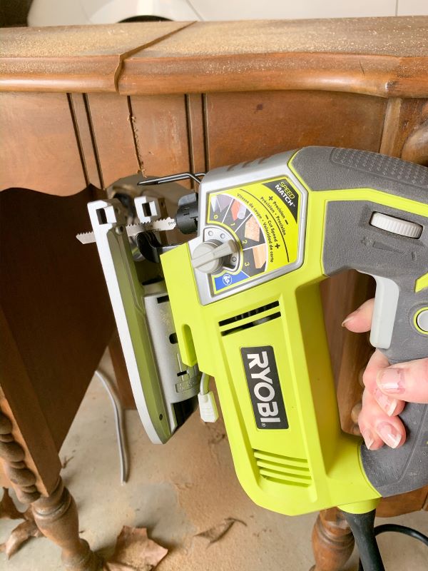 Ryobi jigsaw for cutting down a vanity to end tables in step-by-step process to transform a vanity to painted pink end tables